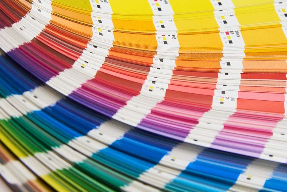 A fanned-out print colour swatch guide